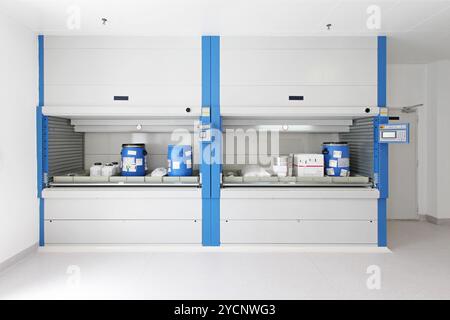 Open vertical carousel with tray goods in warehouse Stock Photo - Alamy
