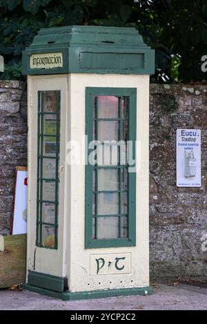 Converted and repurposed public phone box.Former telephone box Ireland being used as a village information point. Stock Photo