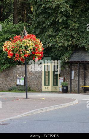 Converted and repurposed public phone box.Former telephone box Ireland being used as a village information point. Stock Photo