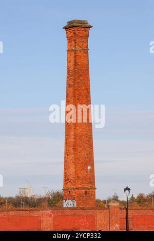 Old red brick free-standing industrial chimney stack in east Belfast on former Short Strand industrial site. Stock Photo