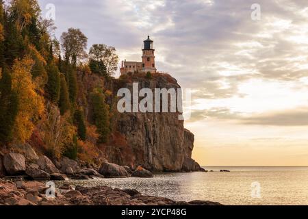 Sunrise On Lake Superior With The Light House At The End Of The Canal 