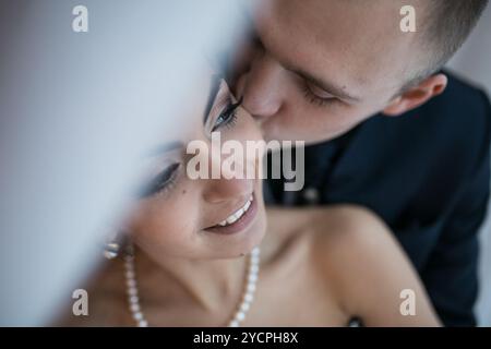 Beautiful European bridal couple in the hotel room Stock Photo