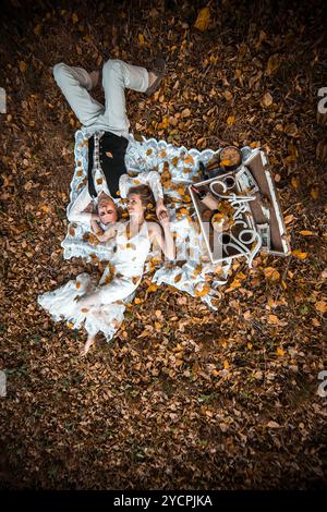 Wedding couple lying under a tree Stock Photo