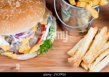 Burger with fried potatos in bucket Stock Photo