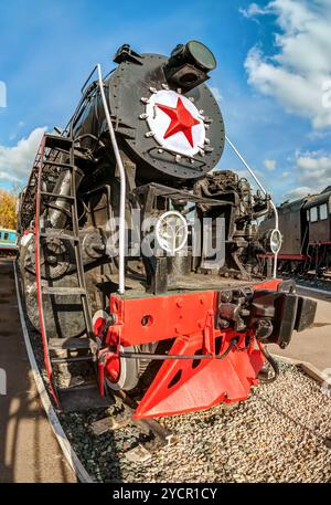 Old russian steam locomotive with red star Stock Photo