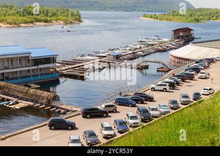 Parking boats and motor boats on the Volga River on a sunny summer day Stock Photo