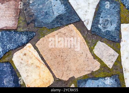 Fragment of a grey stone wall as background Stock Photo