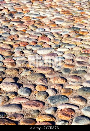Old paved roadway as background close up Stock Photo