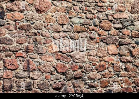 Rough natural old stone wall as background Stock Photo