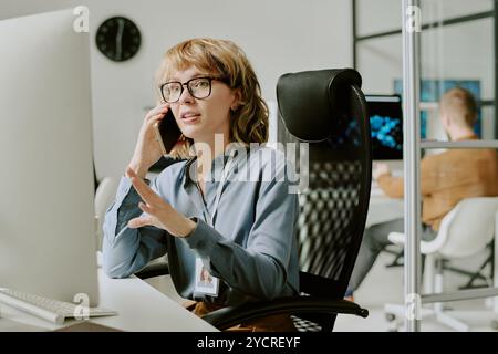 Female Manager Talking on Phone Stock Photo