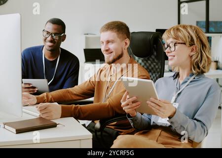 Group of Developers Working In Office Stock Photo