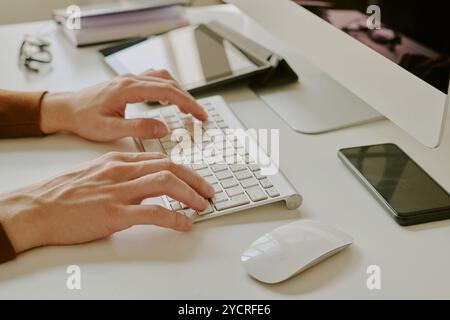 Unrecognizable Male Hands Typing On Computer Keyboard Stock Photo