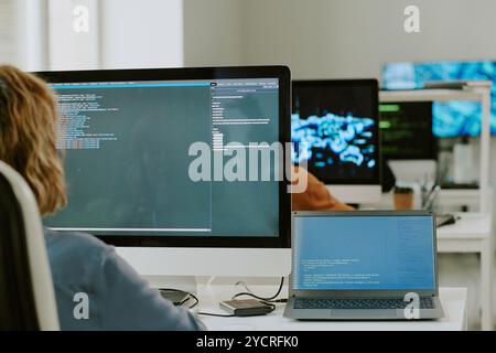 Young Woman Coding On Computer Stock Photo