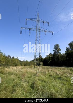 Overhead power lines Power lines on high overhead line electricity pylon High-voltage pylon Power pylon for suspension of electrical overhead lines Po Stock Photo