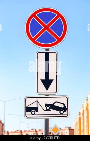 Traffic sign prohibiting parking. Evacuation on tow truck Stock Photo