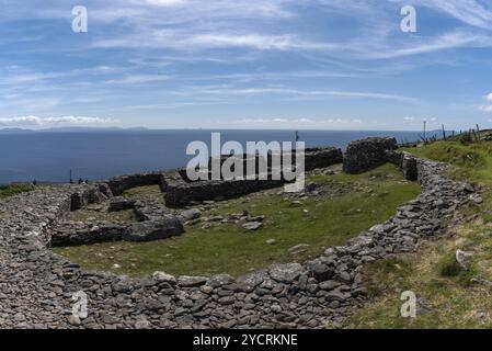 Fahan, Ireland, 5 August, 2022: view of the Fahan beehive huts and ruins the Dingle Peninsula in County Kerry of western Ireland, Europe Stock Photo