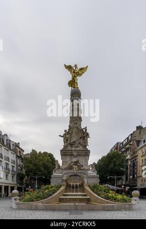 Reims, France- 13 September, 2022: view of the Sube Fountain statue with the golden angel in downtown Reims Stock Photo