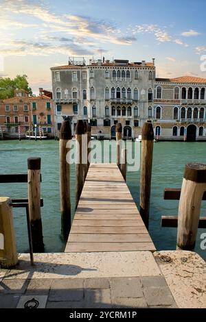 Small wooden jetty on Grand Canal in Venice Stock Photo