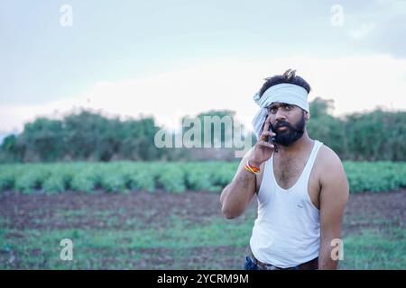 young man using smart phone cellphone for calls, social media, mobile application online Stock Photo