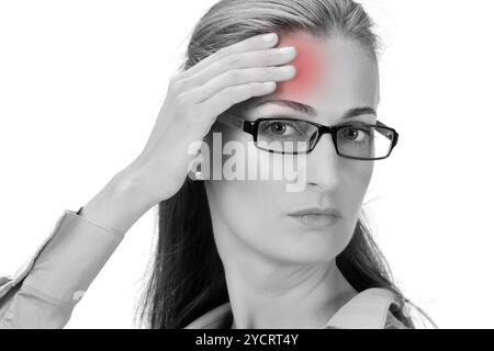 Mature business woman holding head in hands Stock Photo