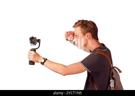 Videographer holds mobile camera on gimbal. Stock Photo