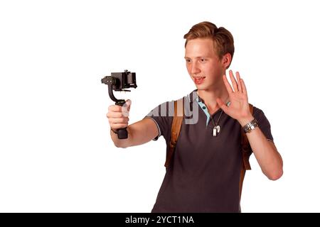 Videographer holds mobile camera on gimbal. Stock Photo