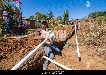 community construction of drinking water pipes, Xullmal, Guatemala, Central America Stock Photo