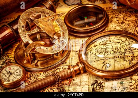 Vintage Compass and magnifying glass lies on an ancient world map ...