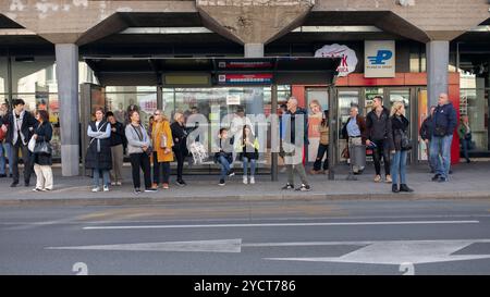 Belgrade, Serbia, Oct 21, 2024: Commuters gathered at a bus stop on Glavna Street in Zemun. Stock Photo