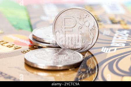 Russian rubles coins over different credit cards close up Stock Photo