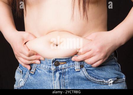 Fat woman's stomach Stock Photo - Alamy