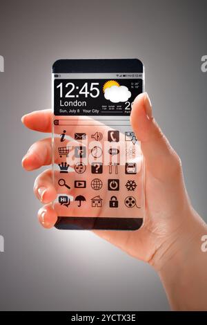 Smartphone with transparent screen in human hands. Stock Photo