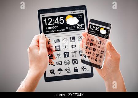 Smartphone and tablet with transparent screen in human hands. Stock Photo