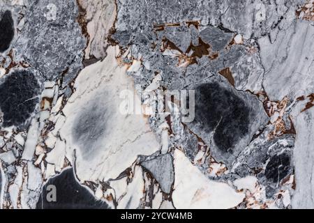 Polished marble surface with strong contrast and vein patterns, ideal for high-end design. Rich black and white marble surface Stock Photo