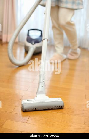 Woman vacuuming Stock Photo