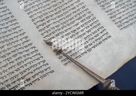 a closeup of jewish holy text Torah with a yad Stock Photo