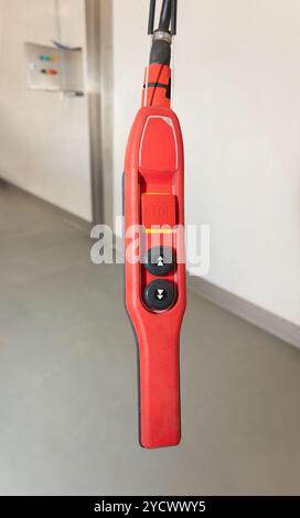 crane red remote control in a factory, indoors clean background Stock Photo