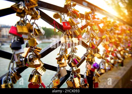 Locks of love on bridge in Paris Stock Photo