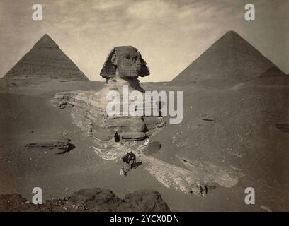 The Great Sphinx partially excavated, with two pyramids in background ...