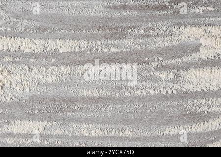 Grey cooking background of spilled wheat flour on stone background, top view. Stock Photo