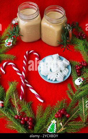 Christmas tree, candy, coffee marshmellou on a red background. Happy New Year Stock Photo