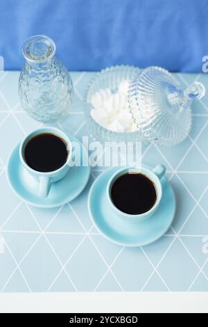 Beautiful composition - coffee, saucer and bowl of marshmallows in geometrical napkin Stock Photo