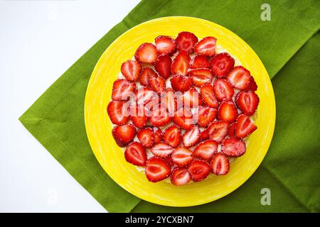 Beautiful strawberry cake is on the table, green napkin Stock Photo