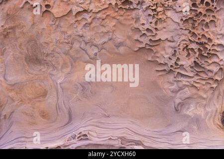 Exquisite natural erosion patterns in Cantabrian sandstone showcasing layered geology of northern Spain. Stock Photo