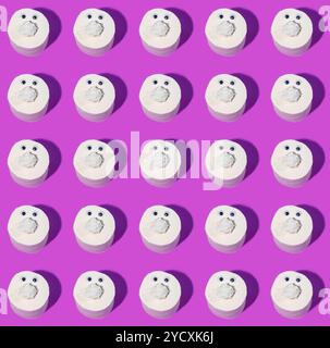 Rows of toilet paper rolls with funny faces on a vibrant purple background. Stock Photo