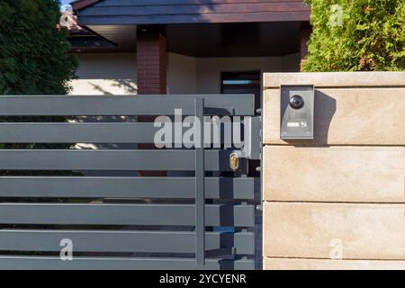 Modern gate with security intercom system Stock Photo