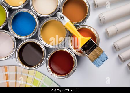 Tin cans with paint and brushes Stock Photo