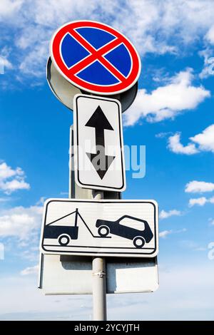 Traffic sign prohibiting parking. Evacuation on tow truck Stock Photo