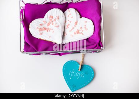Cookies in the form of heart on a pink napkin inscription home Stock Photo