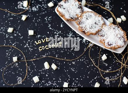Coconut muffins on a black background Stock Photo